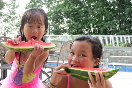 Kasen and Karis eating watermelon